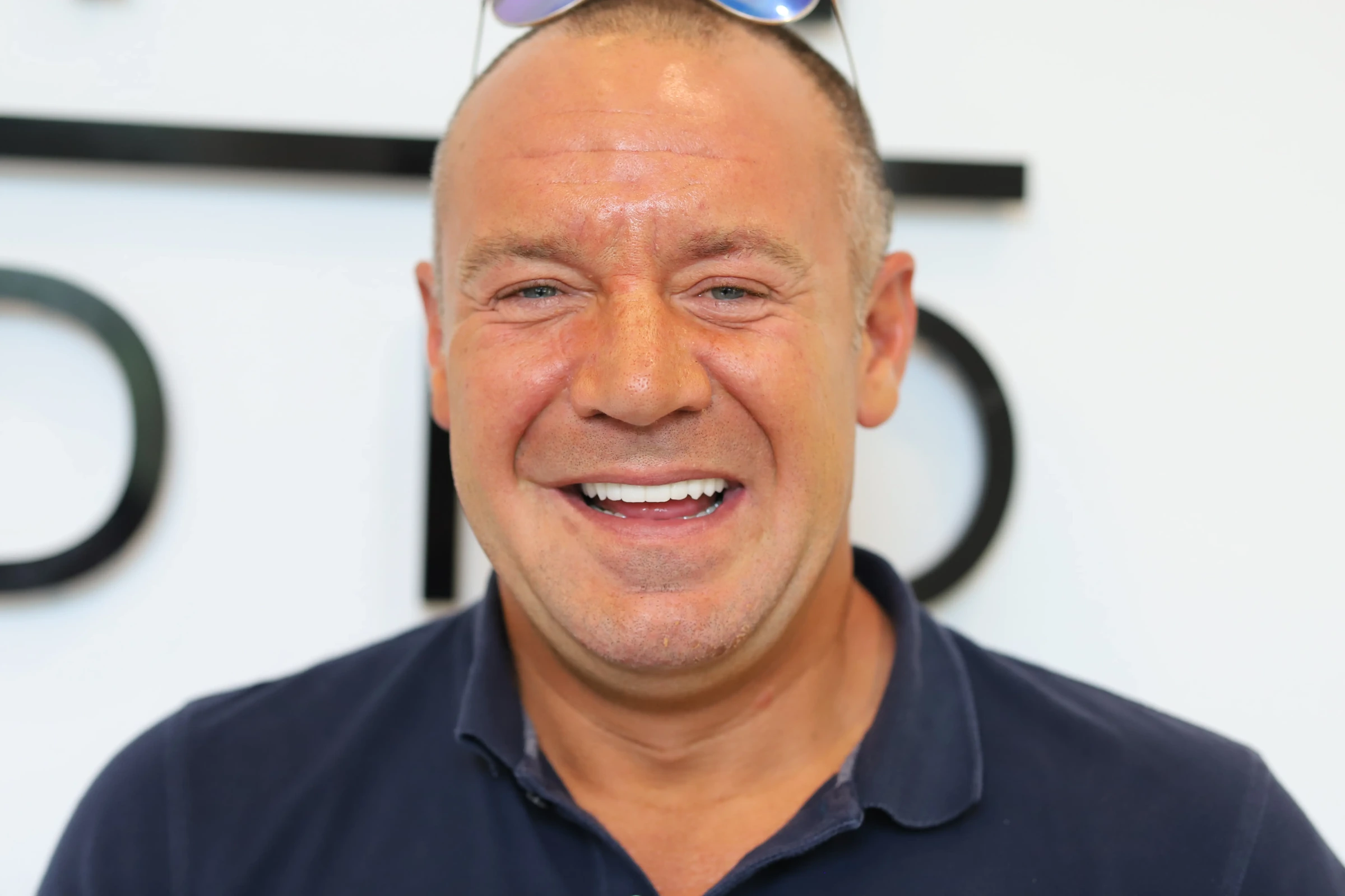 Full-arch implant patient smiling at Destin Implant and Smile Studio